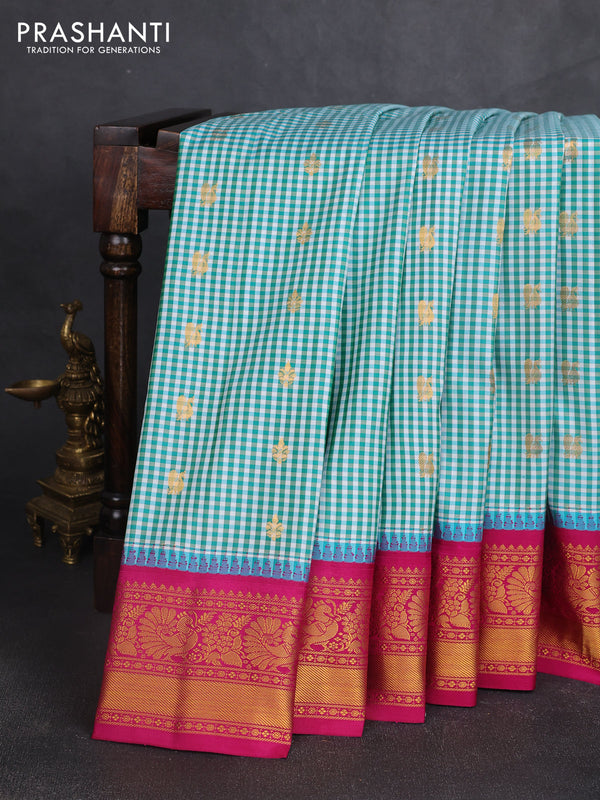 Pure gadwal silk saree off white teal blue and magenta pink with allover checked pattern & zari woven buttas and temple design annam zari woven border