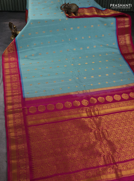 Pure gadwal silk saree off white teal blue and magenta pink with allover checked pattern & zari woven buttas and temple design annam zari woven border