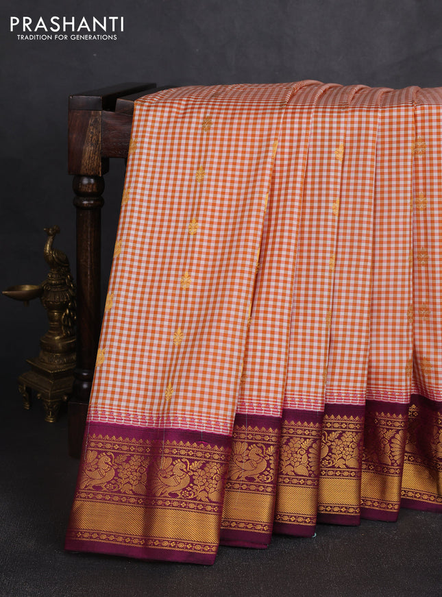 Pure gadwal silk saree off white orange and purple with allover checked pattern & zari woven buttas and temple design annam zari woven border