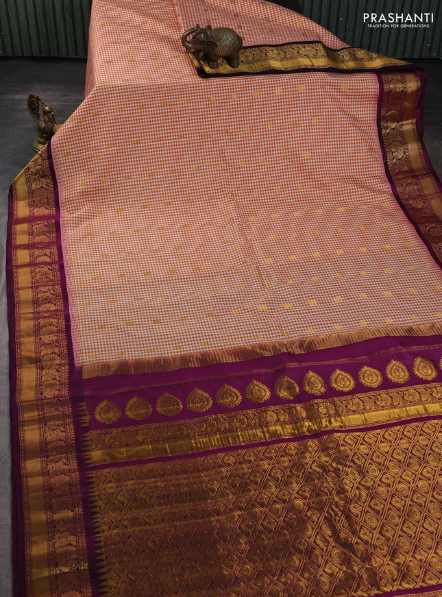 Pure gadwal silk saree off white orange and purple with allover checked pattern & zari woven buttas and temple design annam zari woven border