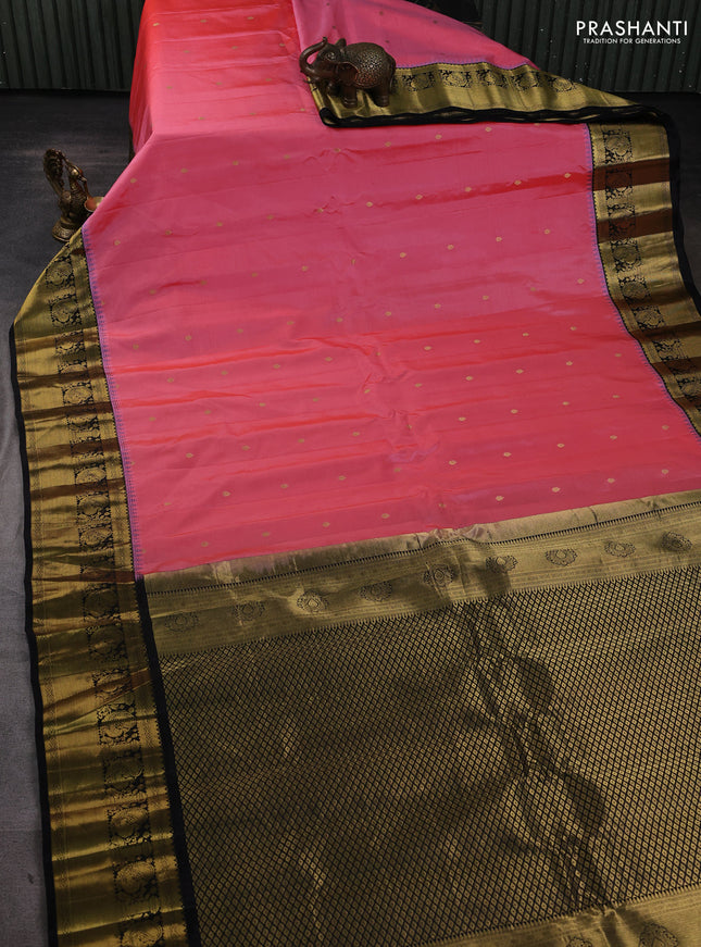 Pure gadwal silk saree peach pink and black with zari woven buttas and temple design zari woven border