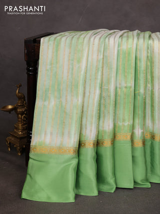Pure mysore silk saree light green with allover zari weaves & shibori prints and zari woven simple border