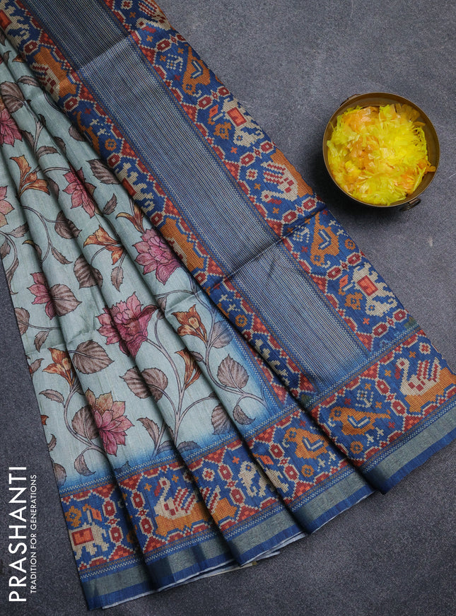 Art tussar saree pastel blue and peacock blue with allover kalamkari prints and patola border
