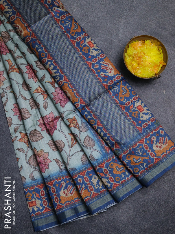 Art tussar saree pastel blue and peacock blue with allover kalamkari prints and patola border