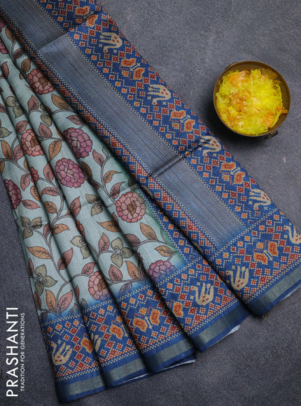 Art tussar saree pastel blue and peacock blue with allover kalamkari prints and patola border
