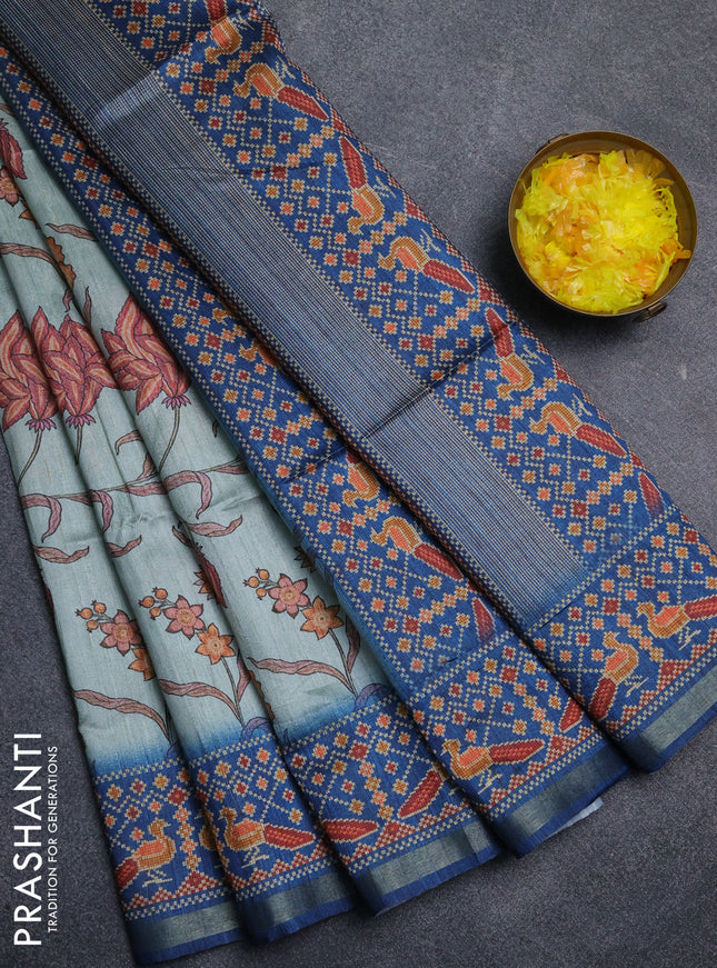 Art tussar saree pastel blue and peacock blue with allover kalamkari prints and patola border