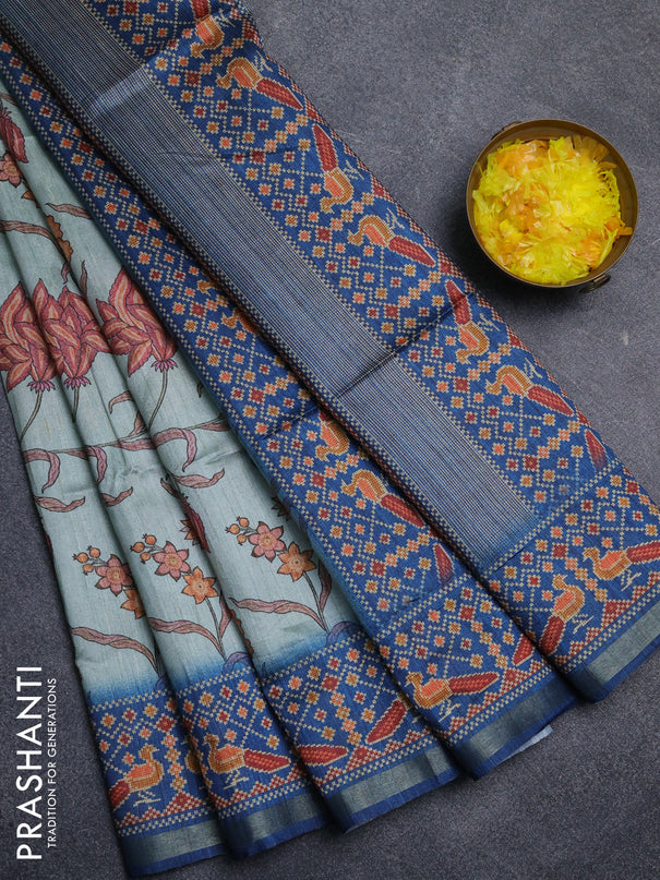 Art tussar saree pastel blue and peacock blue with allover kalamkari prints and patola border
