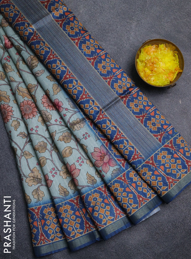Art tussar saree pastel blue and peacock blue with allover kalamkari prints and patola border