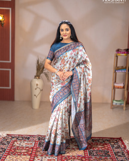 Art tussar saree pastel blue and peacock blue with allover kalamkari prints and patola border