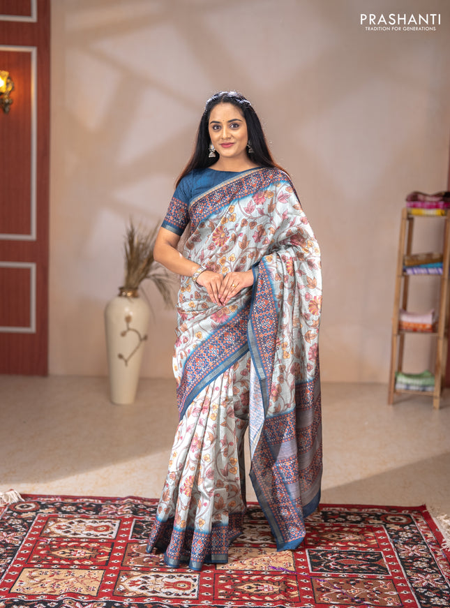 Art tussar saree pastel blue and peacock blue with allover kalamkari prints and patola border