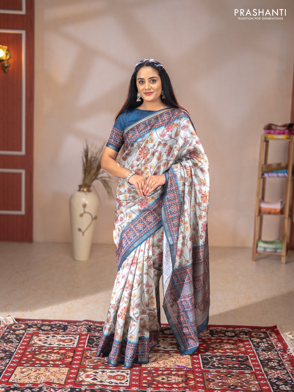 Art tussar saree pastel blue and peacock blue with allover kalamkari prints and patola border