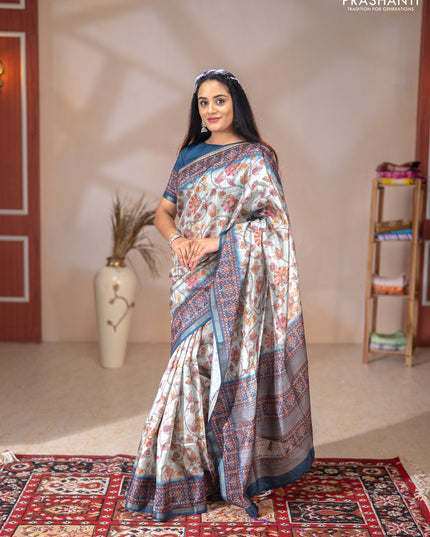 Art tussar saree pastel blue and peacock blue with allover kalamkari prints and patola border