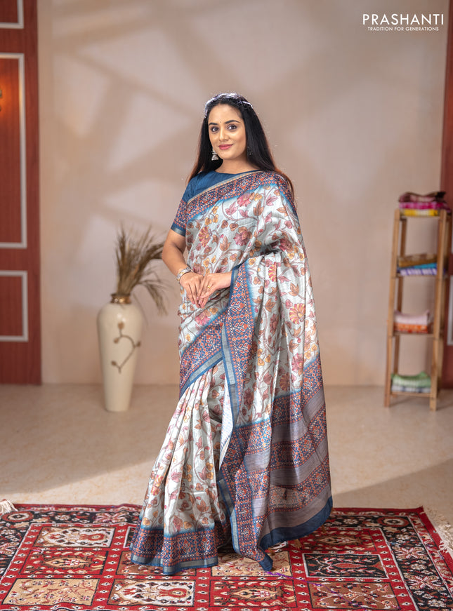Art tussar saree pastel blue and peacock blue with allover kalamkari prints and patola border