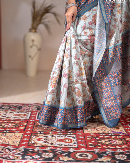 Art tussar saree pastel blue and peacock blue with allover kalamkari prints and patola border