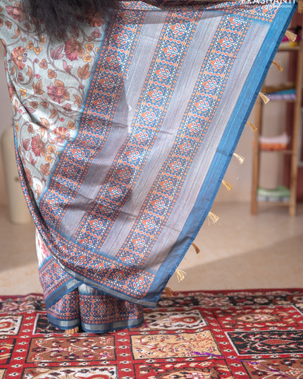 Art tussar saree pastel blue and peacock blue with allover kalamkari prints and patola border