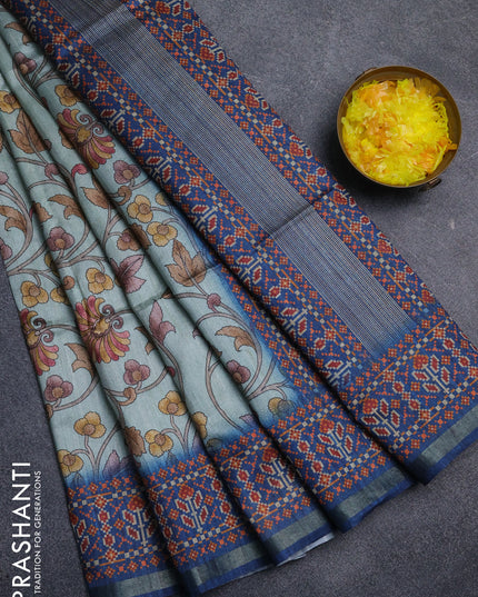 Art tussar saree pastel blue and peacock blue with allover kalamkari prints and patola border