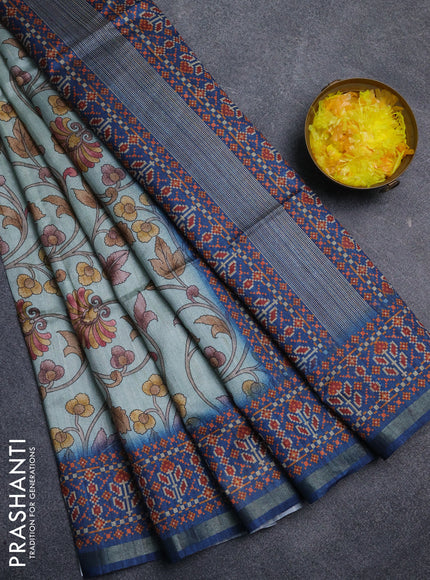 Art tussar saree pastel blue and peacock blue with allover kalamkari prints and patola border