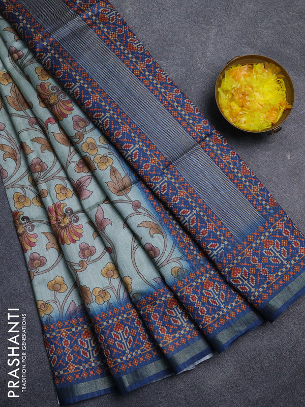 Art tussar saree pastel blue and peacock blue with allover kalamkari prints and patola border