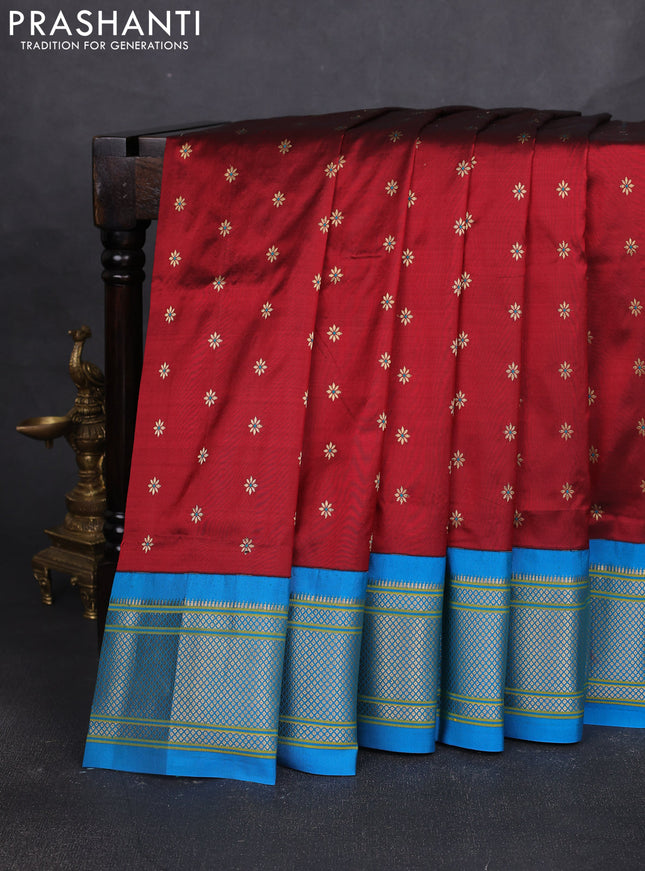 Pure paithani silk saree maroon and cs blue with allover zari woven buttas and paithani weaving pallu