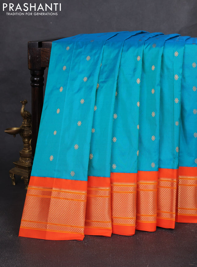 Pure paithani silk saree dual shade of teal bluish green and orange with allover zari woven buttas and paithani weaving pallu