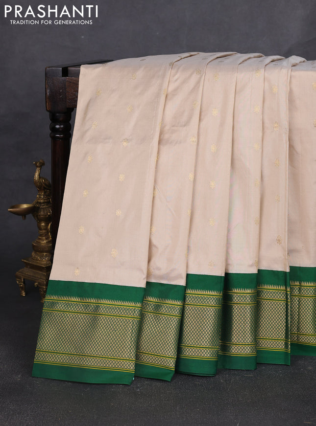 Pure paithani silk saree cream and green with allover zari woven buttas and paithani weaving pallu