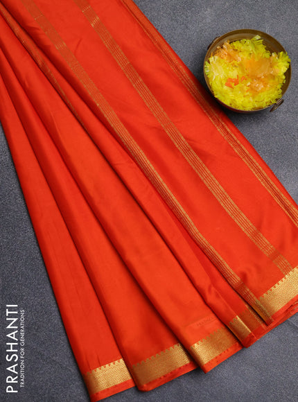 Semi mysore silk saree orange with plain body and zari woven border