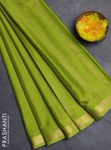 Semi mysore silk saree light green with plain body and zari woven border