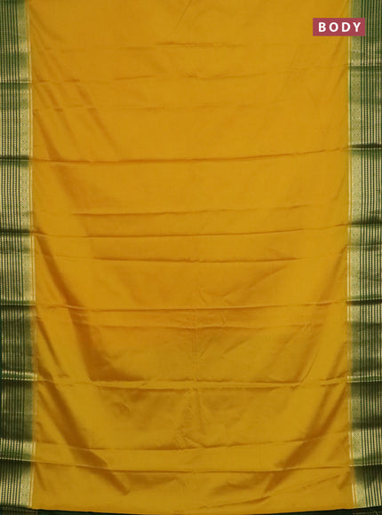 Semi mysore silk saree yellow and green with plain body and zari woven border