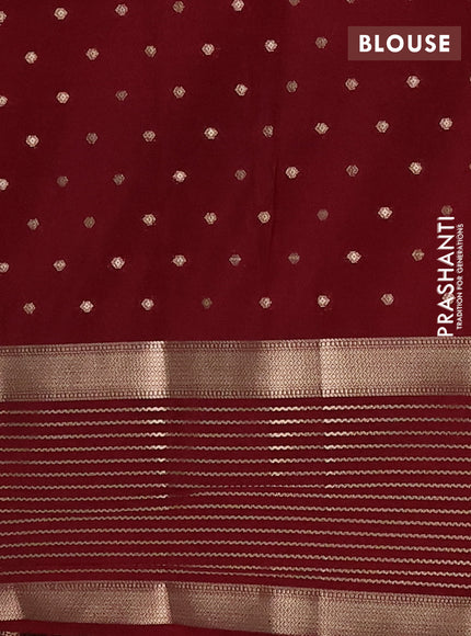Semi mysore silk saree orange and maroon with allover zari woven buttas and long zari woven border