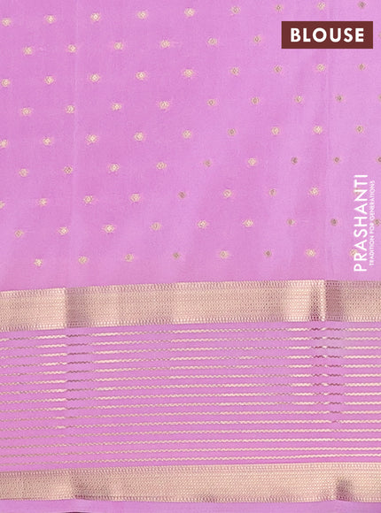 Semi mysore silk saree bottle green and lotus pink with allover zari woven buttas and long zari woven border