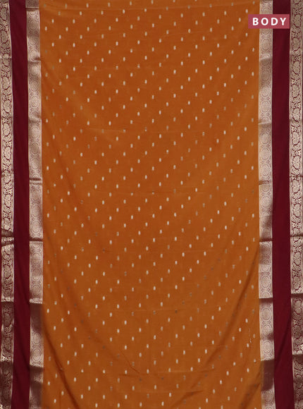 Semi mysore silk saree dark mustard and wine shade with allover zari woven buttas and long rettapet zari woven border