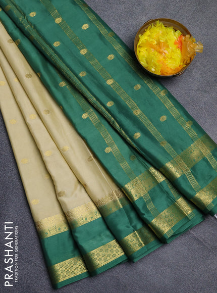 Semi mysore silk saree cream and light green with allover zari woven buttas and rettapet zari woven border