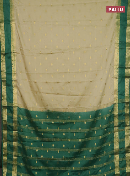Semi mysore silk saree cream and light green with allover zari woven buttas and rettapet zari woven border