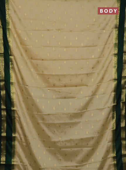 Semi mysore silk saree cream and bottle green with allover zari woven buttas and rettapet zari woven border