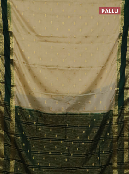 Semi mysore silk saree cream and bottle green with allover zari woven buttas and rettapet zari woven border