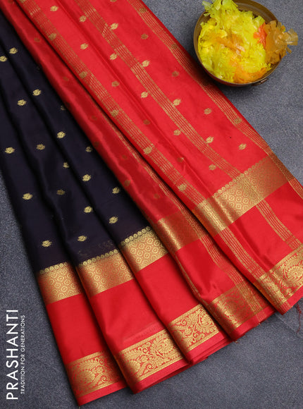 Semi mysore silk saree black and orange with allover zari woven buttas and long rettapet zari woven border