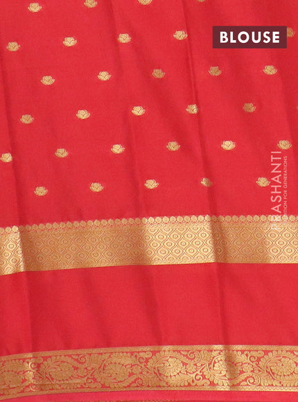 Semi mysore silk saree black and orange with allover zari woven buttas and long rettapet zari woven border