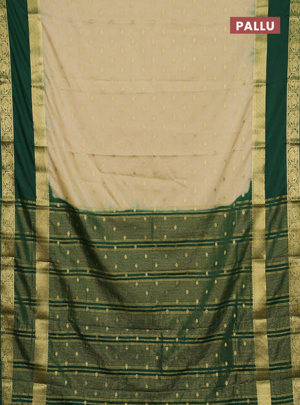 Semi mysore silk saree cream and bottle green with allover zari woven buttas and long rettapet zari woven border