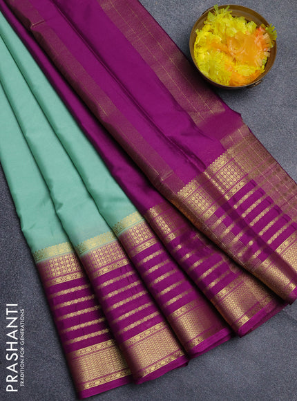 Semi mysore silk saree pastel green with plain body and long zari woven border
