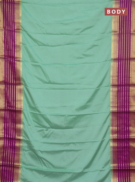Semi mysore silk saree pastel green with plain body and long zari woven border