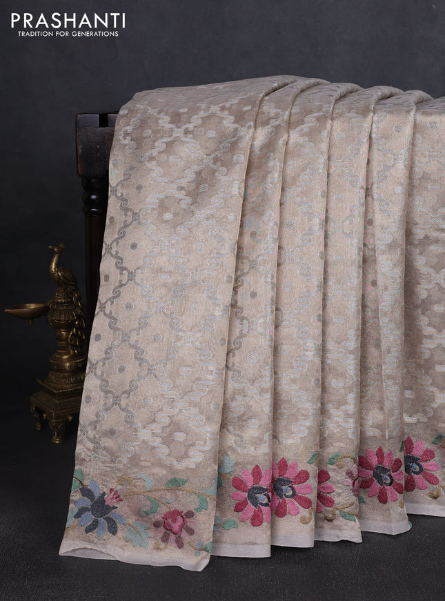 Tissue saree beige with allover zari woven brocade weaves and embroidery work border