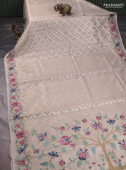 Art tissue saree beige with allover zari woven brocade weaves and embroidery work border