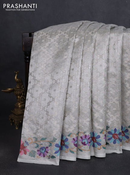Art tissue saree pastel grey with allover zari woven brocade weaves and embroidery work border
