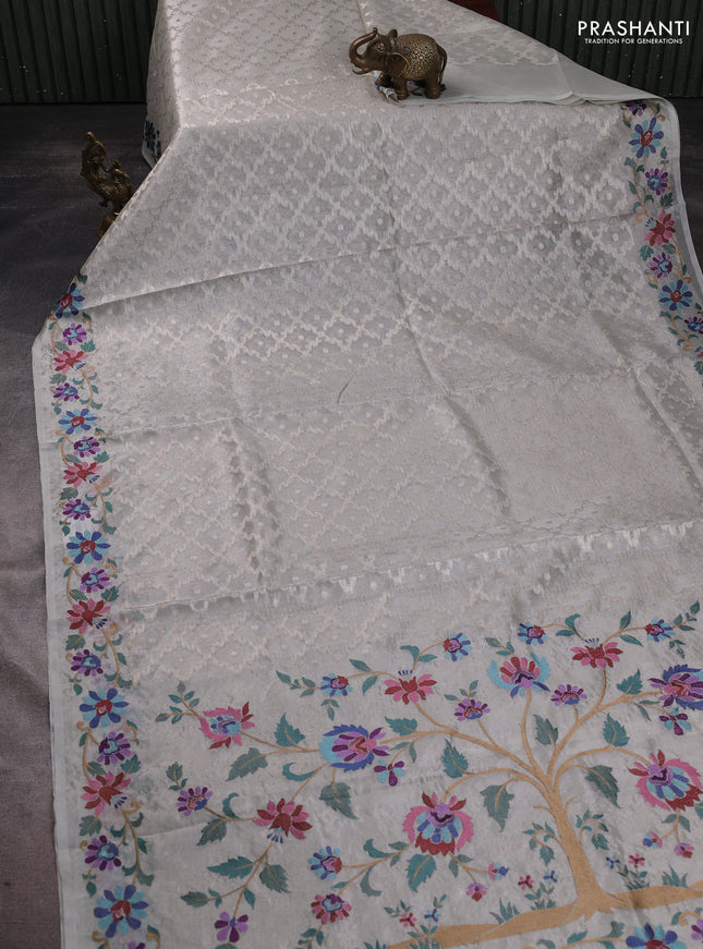 Tissue saree pastel grey with allover zari woven brocade weaves and embroidery work border