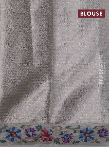 Art tissue saree pastel grey with allover zari woven brocade weaves and embroidery work border