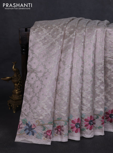 Art tissue saree pastel pink shade with allover zari woven brocade weaves and embroidery work border