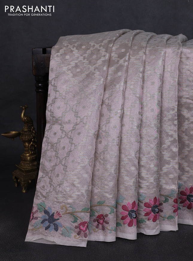 Tissue saree pastel pink shade with allover zari woven brocade weaves and embroidery work border