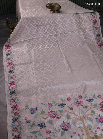 Art tissue saree pastel pink shade with allover zari woven brocade weaves and embroidery work border
