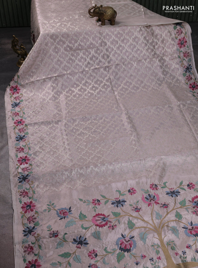 Tissue saree pastel pink shade with allover zari woven brocade weaves and embroidery work border