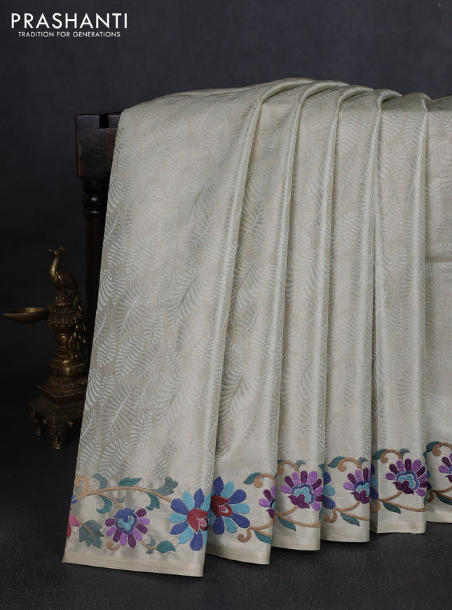 Tissue saree beige with allover zari woven brocade weaves and embroidery work border